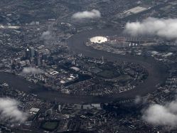 Flying over London - see the Dome and Canary wharf.